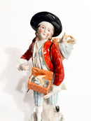 Statuina in Porcellana Policroma Sitzendorf di Venditore di Conigli del 1800