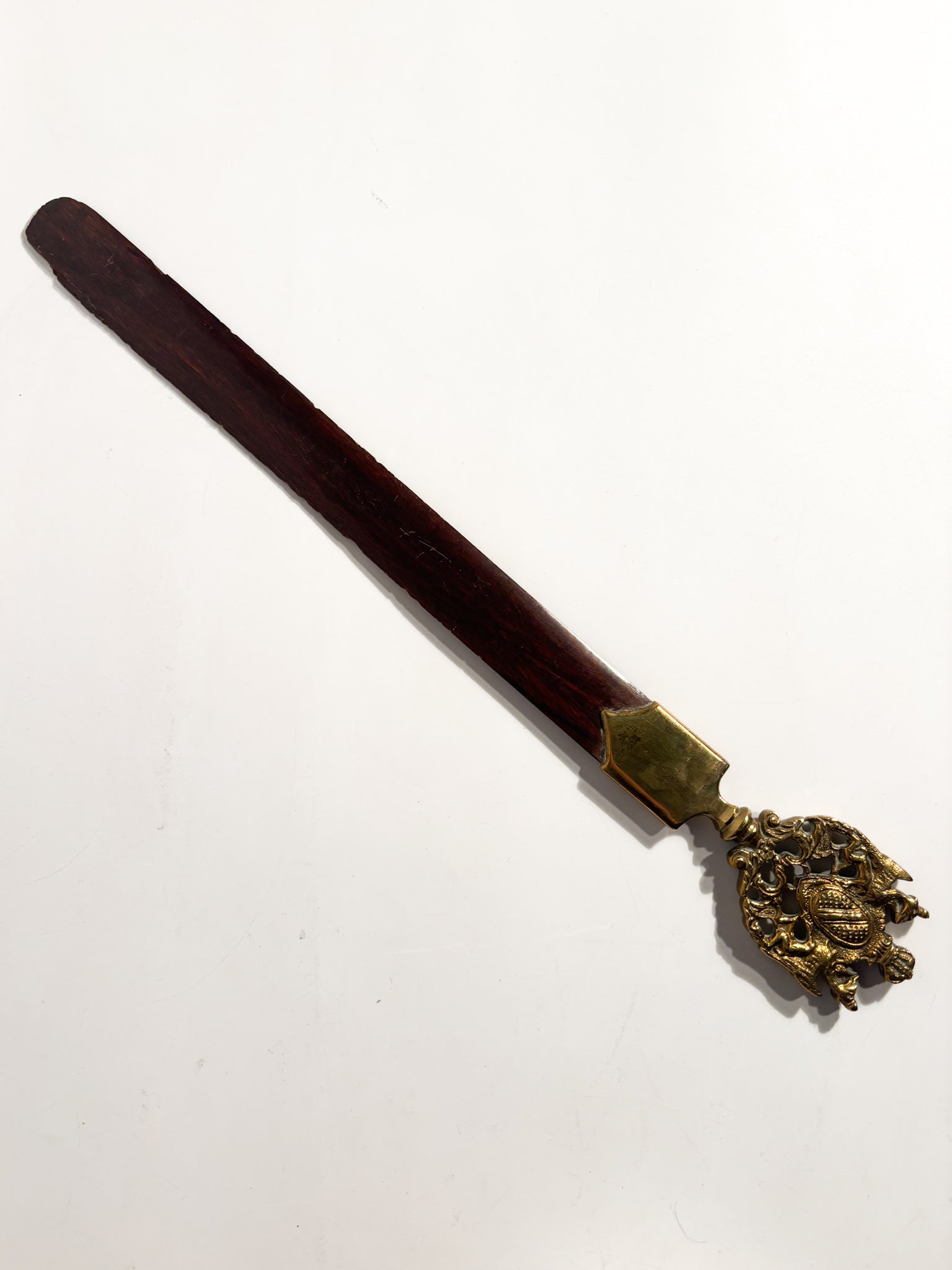 Letter opener with gilded bronze emblem and wood, 1930s